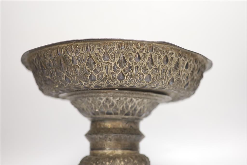 A late 19th/early 20th century Burmese? repousse white metal pedestal bowl(a.f.), height 24cm, gross 29.5oz.